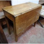 A 31 1/2" antique single drop-leaf table, set on square legs