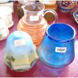 A blue glass vase with silver iridescent overlay, a hooped glass jug and a lampshade with seascape