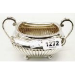 A silver sugar bowl of reeded design with parcel gilt interior by James Dixon - Sheffield 1894