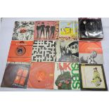 A collection of vinyl 45 singles including Slade, The Sweet, The Jam, PiL, etc.
