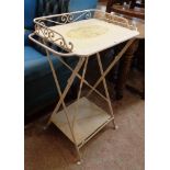 A decorative painted pressed metal two tier bathroom stand with folding frame