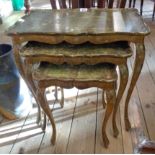 A nest of three reproduction ornate giltwood tea tables, set on slender cabriole legs - worn