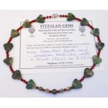 A boxed Fitzalan Gems moss agate and polished carnelian bead necklace - with certificate