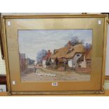 Richard Wane: a gilt framed and slipped watercolour, depicting a village street scene with figure