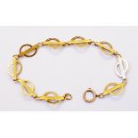 A marked 9ct. yellow metal fancy link bracelet with engine turned and pierced decoration