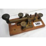 A vintage Morse key on wooden base