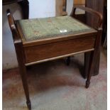 An Edwardian mahogany and strung locker piano stool with flanking open rests and studded seat panel