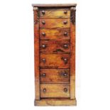A 17" 19th Century walnut Wellington chest of seven drawers with acanthus scroll capitals to the