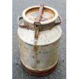 A vintage aluminium churn with lid clip