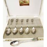 A cased set of six Flynn Australian marked 'stg.sil' ornate coffee spoons with pierced and opal