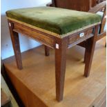 An early 20th Century stained oak framed locker piano stool with upholstered seat and moulded apron,