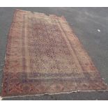 An antique Bakhtiari kilim rug with repeat panel field within multi floral borders - 8' 5" X 5'