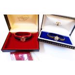 A boxed 9ct. gold cased Tissot lady's wristwatch with seventeen jewel movement - sold with a boxed