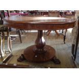 A 3' 8" diameter 19th Century mahogany breakfast table, set on reeded bulbous pillar and circular