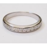 A Tiffany & Co. marked PT950 white metal 'Lucida' diamond encrusted half eternity ring