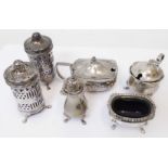Six assorted silver condiment items comprising pair of peppers, another, two mustard pots and a salt