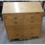 A 3' 2" 19th Century waxed pine bureau with part fitted interior, two short and three long graduated
