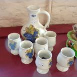 A Prinknash Pottery wine set comprising six goblets and a flagon