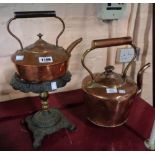 A copper range kettle - sold with a copper kettle on brass and cast iron stand