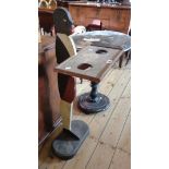 A vintage painted wood figural stand with two apertures to tray top and loaded oval base