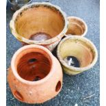 Three various sized terracotta pots - sold with a strawberry pot