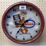 A reproduction pressed painted metal cased Esso advertising wall timepiece with battery movement