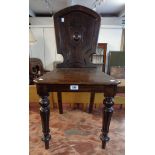 A late Victorian stained oak hall chair, set on turned and moulded front legs - repairs