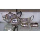 A silver plated tea set of semi reeded oval design - sold with a pair of salts