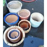 Ten assorted decorative glazed terracotta garden pots of varying size and design - the largest 15"