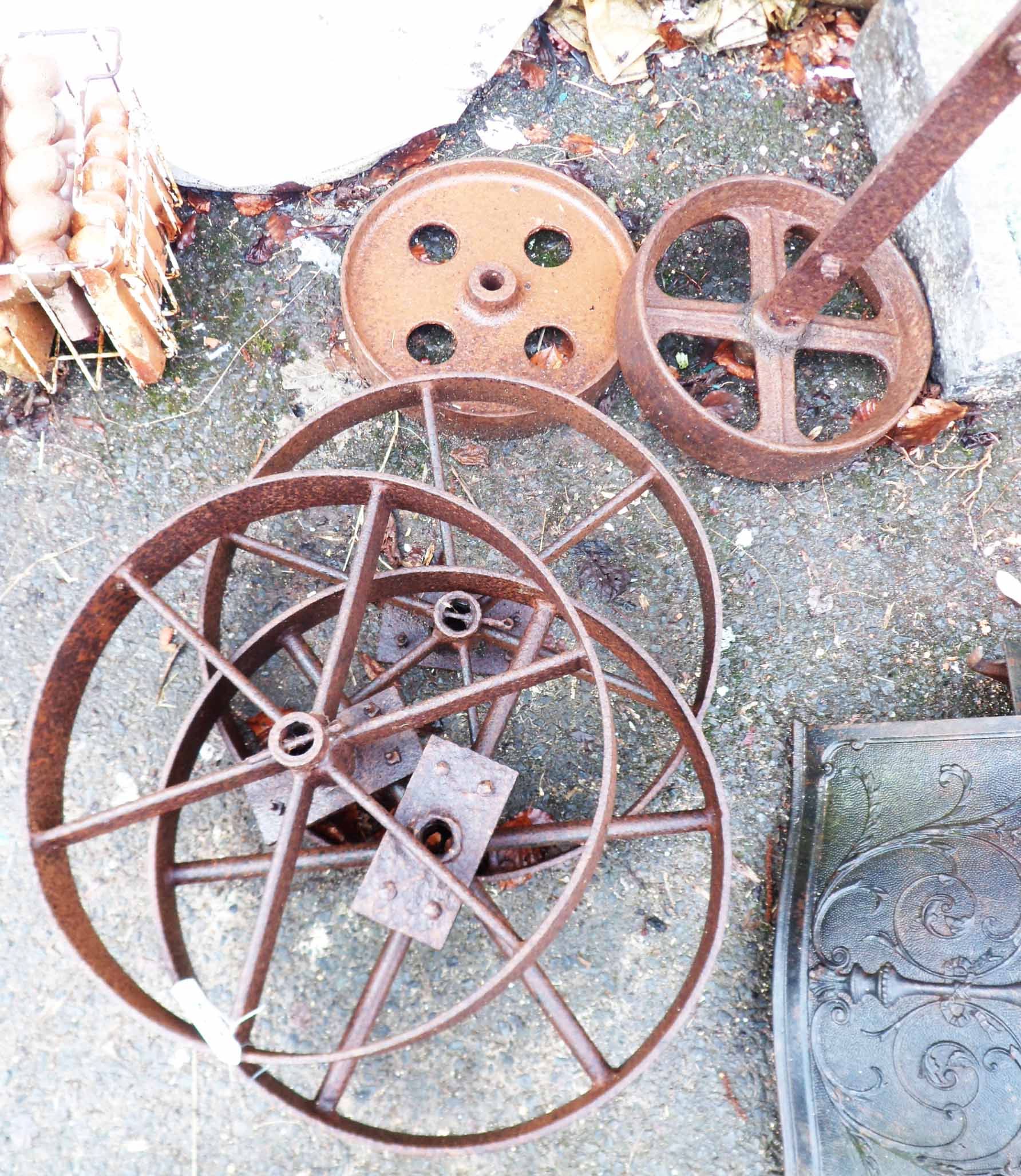 Three cast iron pulley wheels - sold with two others similar