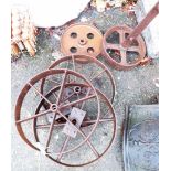 Three cast iron pulley wheels - sold with two others similar