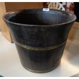 A 13" diameter brass bound stained wood coopered bucket