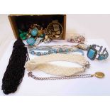 A box containing a quantity of costume jewellery including necklaces, bracelets, etc.