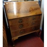 A 30" reproduction mahogany bureau with part fitted interior and three long graduated drawers under,