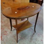 A 30" Edwardian walnut inlaid and strung oval occasional table with shaped undertier, set on swept