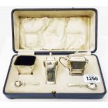 A cased Art Deco Mappin & Webb silver three piece condiment set with original mustard spoon and