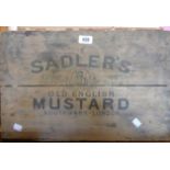 An early 20th Century advertising box for Sadler's Old English Mustard with stamped lid and paper
