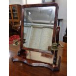 A Victorian flame mahogany veneered platform dressing table mirror with applied brass candle