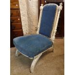 A Victorian later painted nursing chair with flanking turned and fluted back supports and later blue
