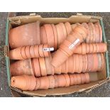 A collection of assorted terracotta pots