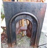 A Victorian cast iron arch fronted bedroom fire surround