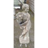 A 35" concrete garden statue of a cornucopia bearer