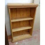 A 22 3/4" late 20th Century waxed pine three shelf open bookcase