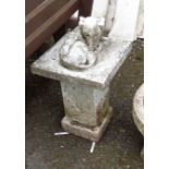 A cast concrete statue of a dog sleeping on a pedestal - height 28 1/2"