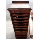 An early 20th Century oak filing cabinet with nine slides enclosed by tambour front