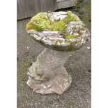 A classical style dolphin and shell shaped bird bath - height 20 1/2"