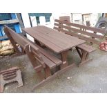 A 5' 11" stained wood picnic table with pair of benches to match