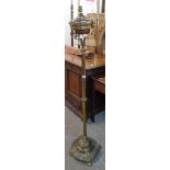 A Victorian brass ornate telescopic lamp standard with reeded pillar and decorative loaded
