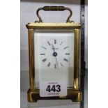 A 20th Century Angelus brass and bevelled glass cased carriage timepiece with eight day movement