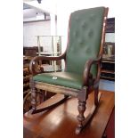 A Victorian mahogany framed rocking chair with later button back upholstery and open scroll